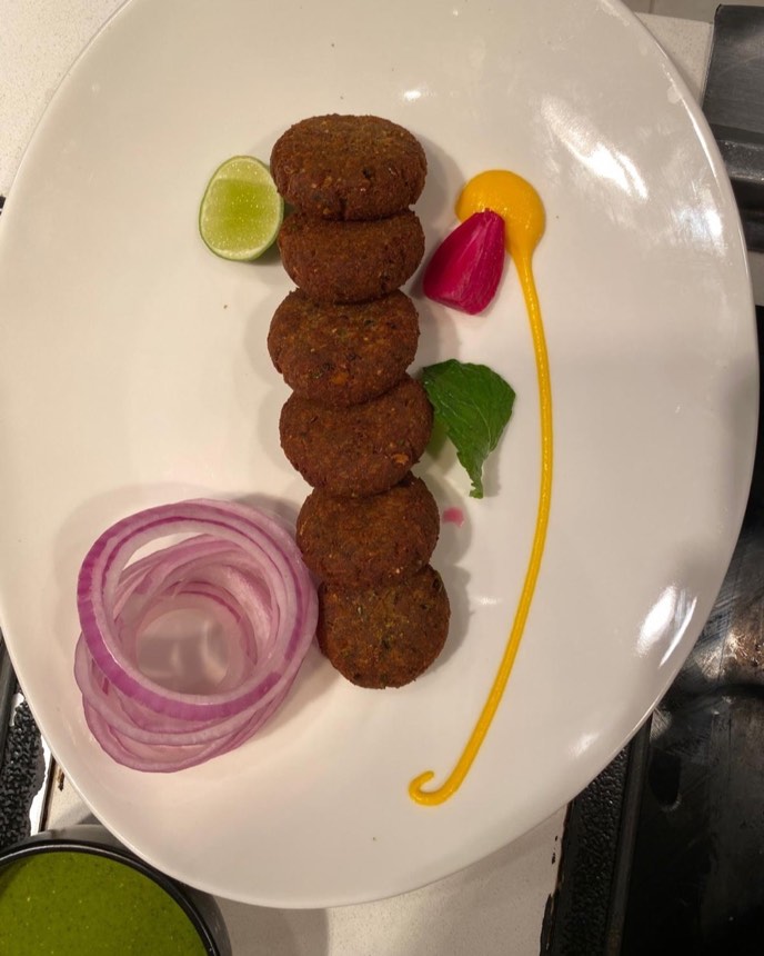 Shami kebab — soft spiced patties with onion rings